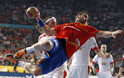 Spain's Garcia attempts to score in front of Denmark's Hansen during their Men's Handball World Championship final match in Barcelona