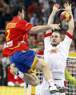 Denmark's Jensen blocks a shot of Spain's Entrerrios during their Men's Handball World Championship final match in Barcelona