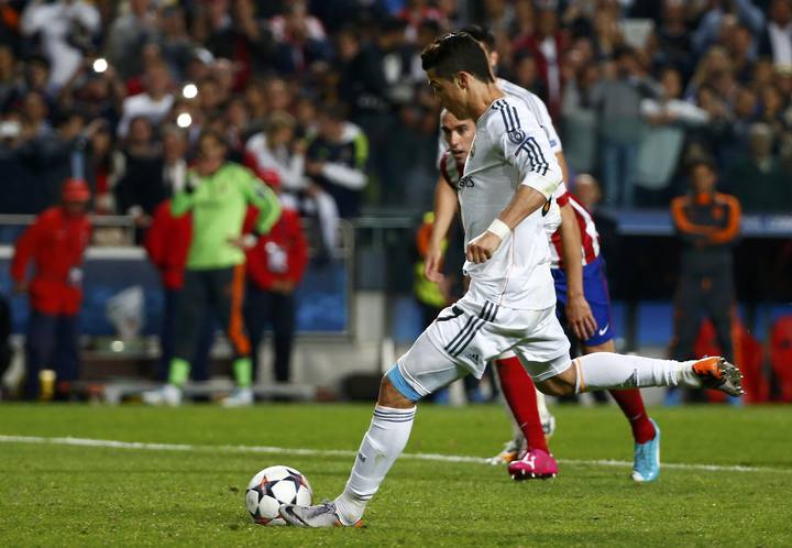 Real Madrid's Ronaldo scores a penalty against Atletico Madrid during their Champions League final soccer match at the Luz Stadium in Lisbon